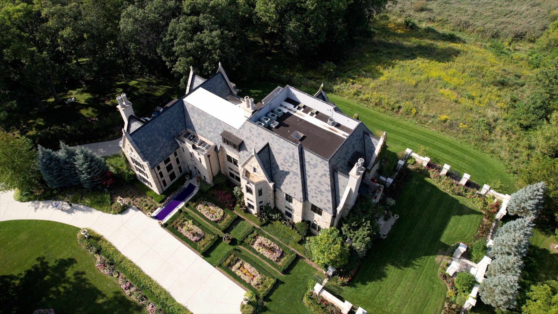 Aerial view of a large property and its surrounding grounds